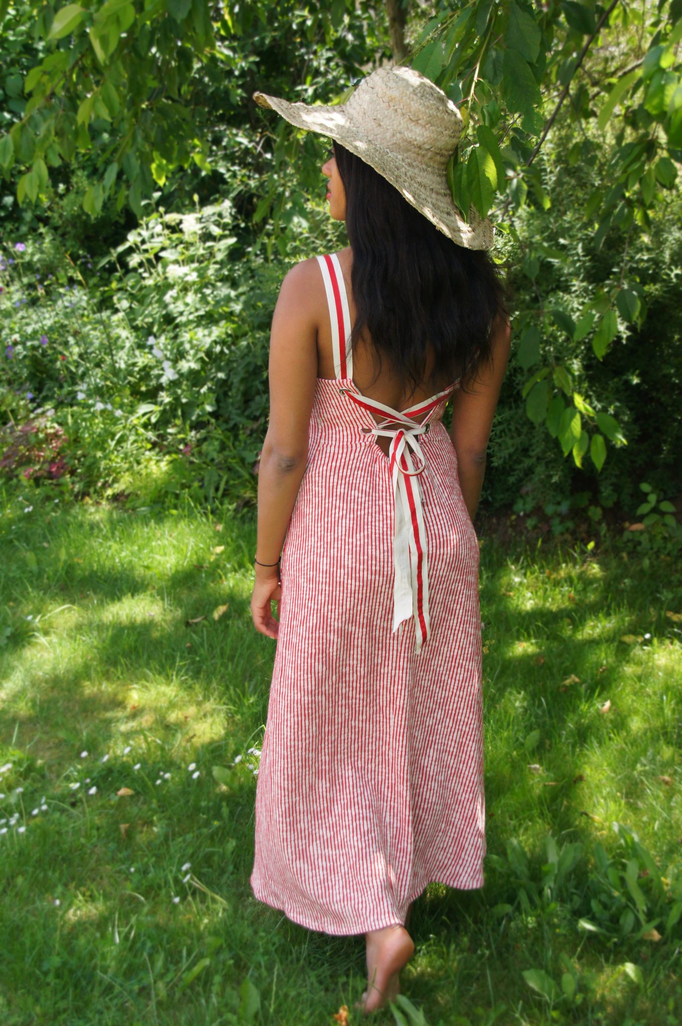 wearing a striped dress for a garden party