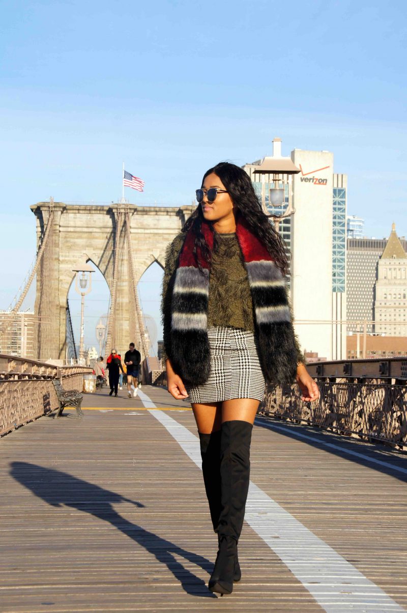 wintery outfit with fake fur pieces on brookly bridge