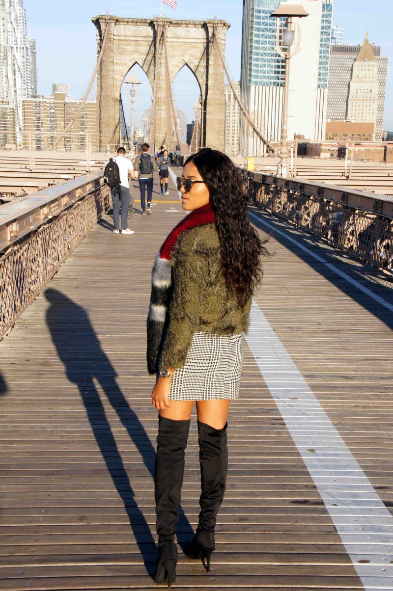 wintery outfit with fake fur pieces on brookly bridge