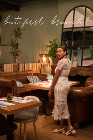 black girl wearing a white dress on a brunch date