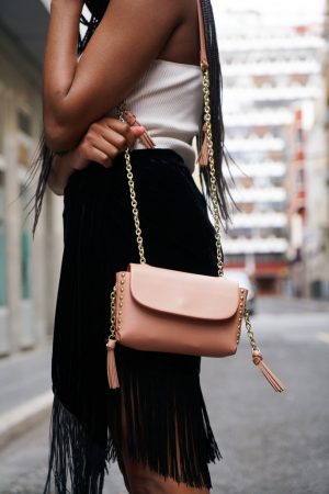 wearing fringes with crossbody bag