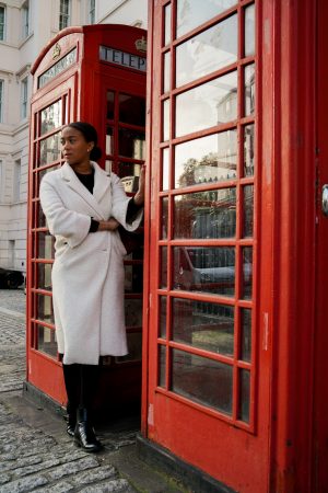 wearing a white coat in London