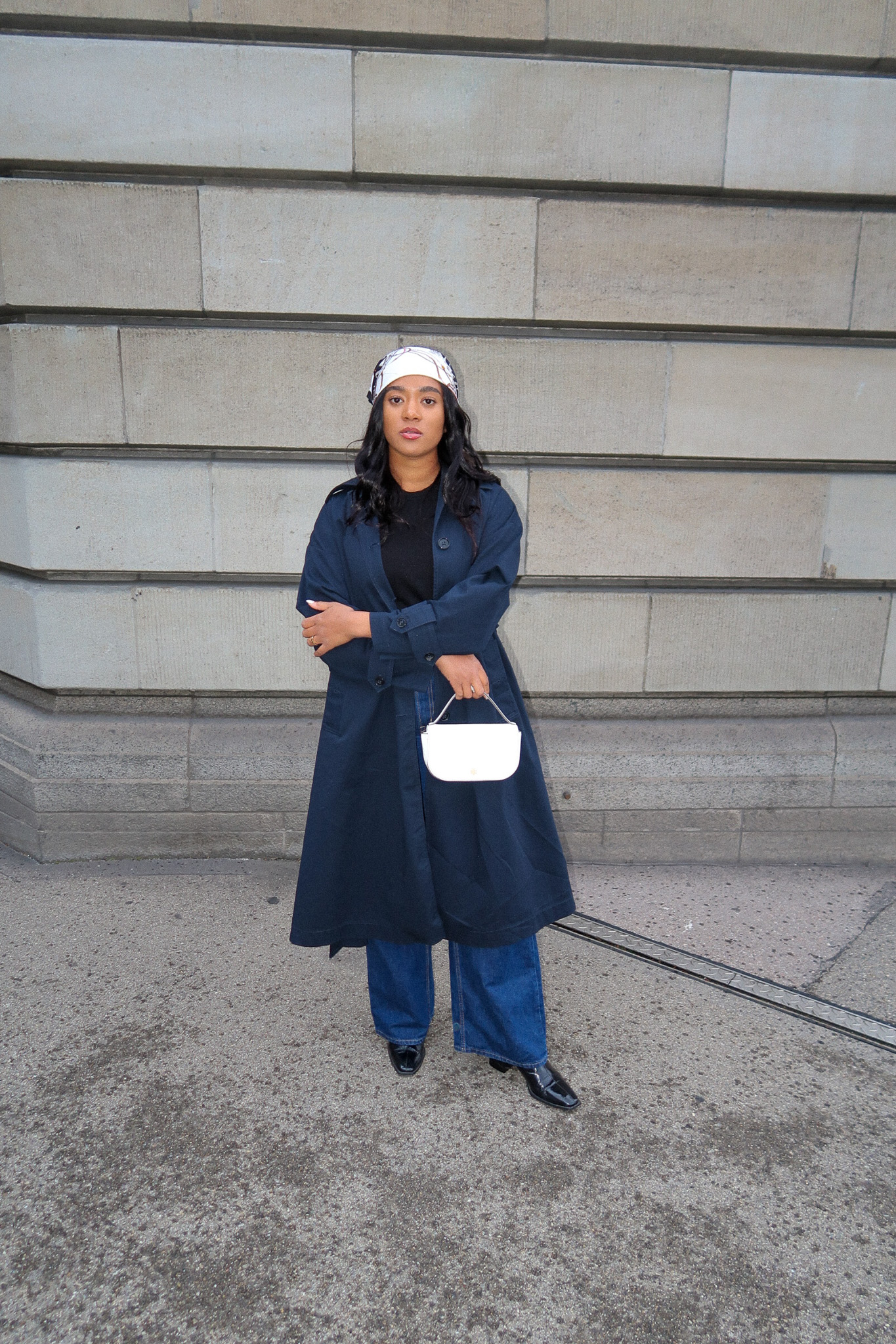 girl wearing a dark blue trench coat navy blue trench in Zürich