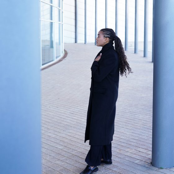 Wearing the black coat I wanted to buy years ago