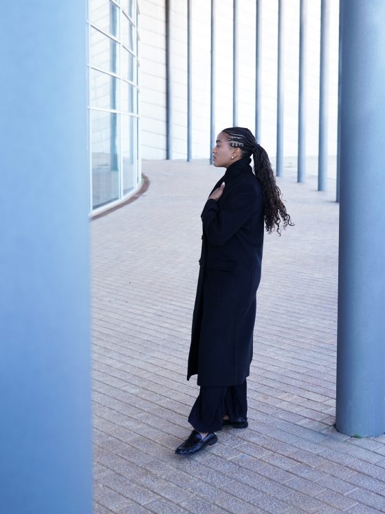 Wearing the black coat I wanted to buy years ago