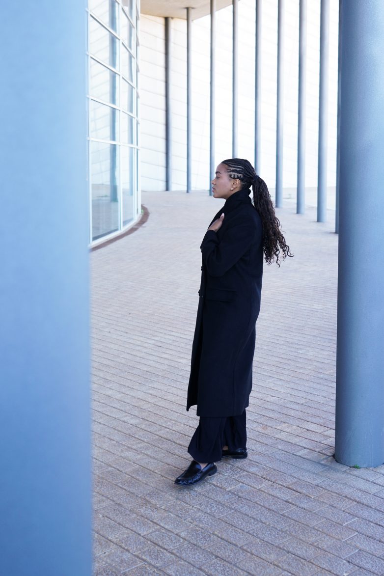 Wearing the black coat I wanted to buy years ago